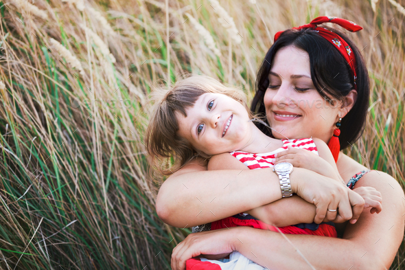 family - happy mother and daughters Stock Photo by azgek PhotoDune